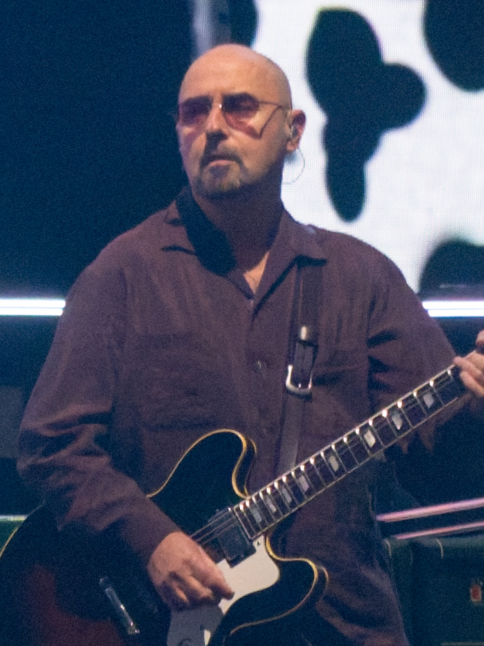 Oasis performing in Cardiff in 2025